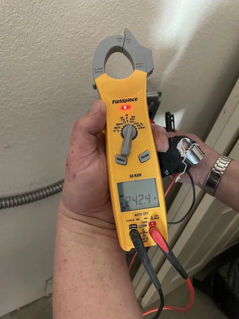 Voltage testing with clamp meter during Generator Installation in Lackland AFB